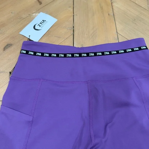 ZYIA Active Purple Game Day Performance 7/8 Leggings Yellow Cuffs size 4 NWT - Picture 9 of 10